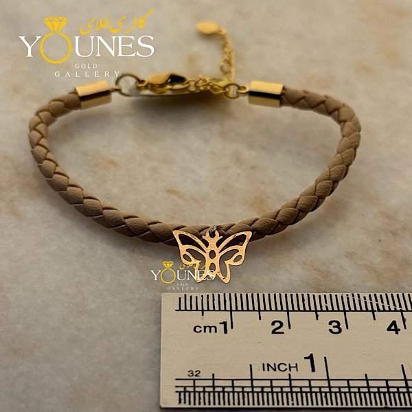 دستبند چرم کرمی پروانه لیزری طلا